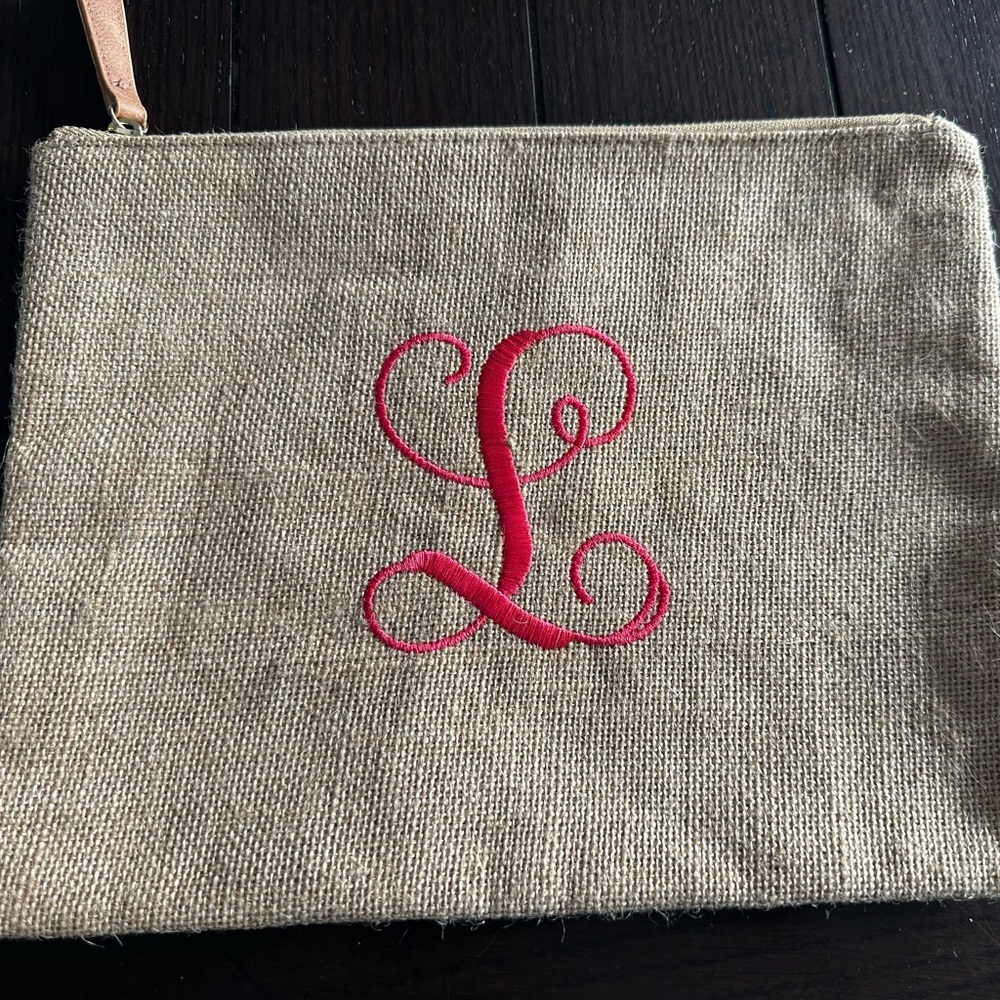 Stylish Tan Clutch with Pink “L” Monogram